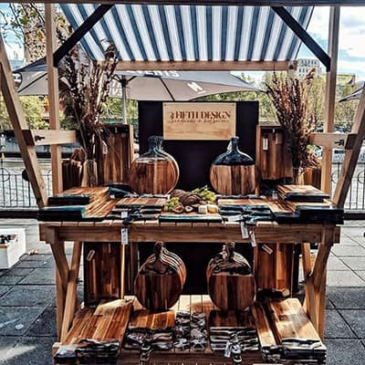 Market stall selling resin decorated wooden chopping boards