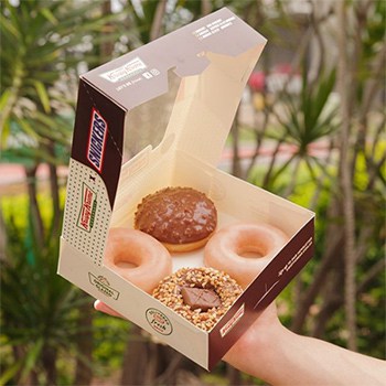 Four Snickers doughnuts by Krispy Kreme