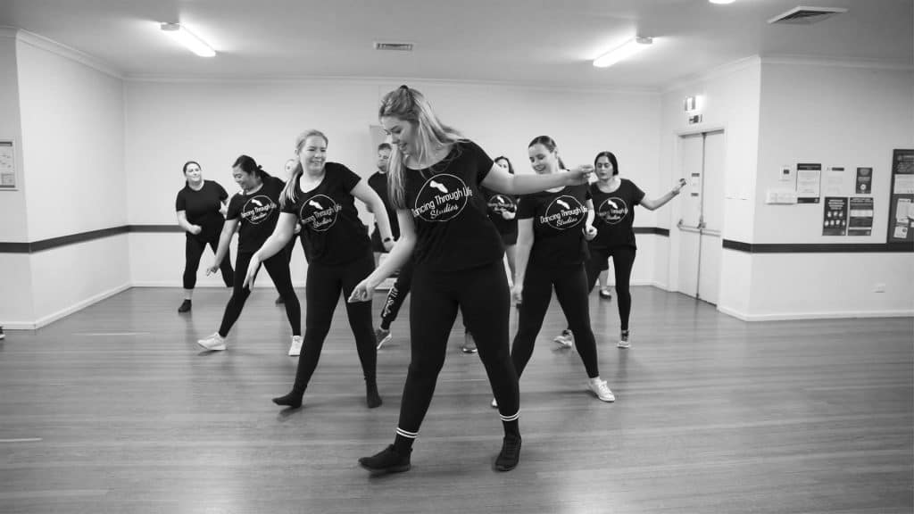 Small Business Owner Lauren Dancing and Posing with a group of Dancers