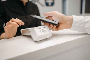 cashless payment system being used to purchase an item from a small business