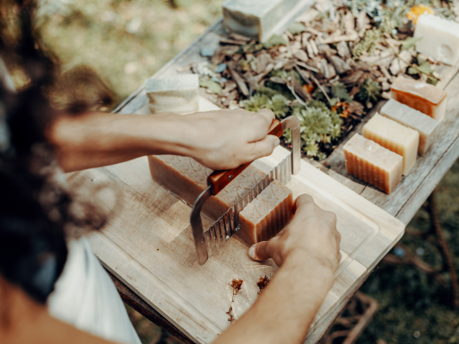 Soap Making - A slab of soap being cut