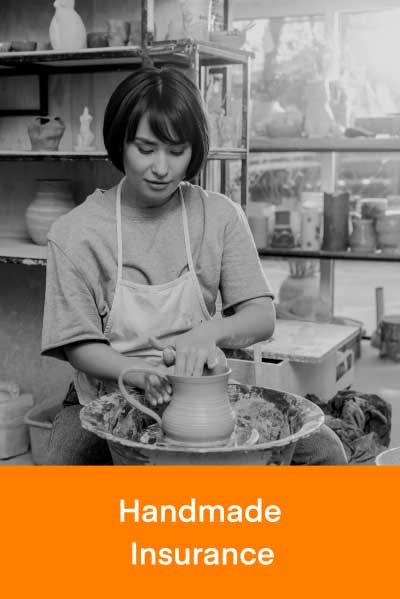 An artist making pottery on a potter's wheel