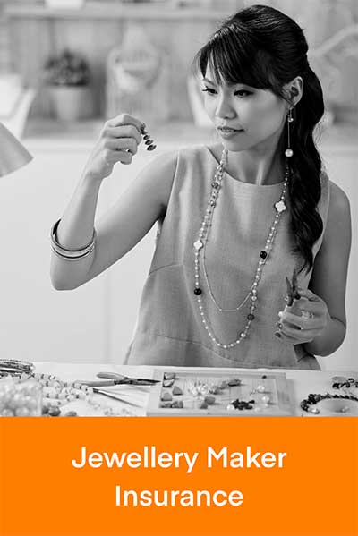 Woman threading beads to make jewellery