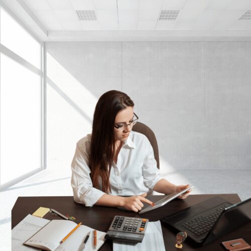 Bookkeeper Insurance - Bookkeeper working on client file (1080 x 1080 px)